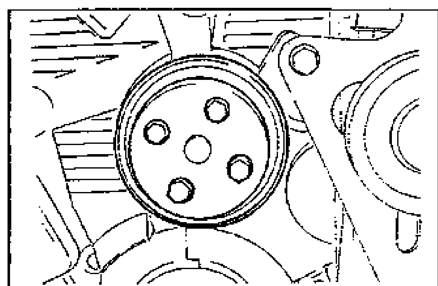 Water pump pulley installed on the engine, showing the four mounting bolt holes around the central hub.
