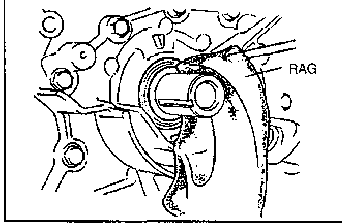 Line drawing showing oil seal removal: a screwdriver protected with a rag prying out the front oil seal at the oil pump/cover. Labeled 'RAG'.