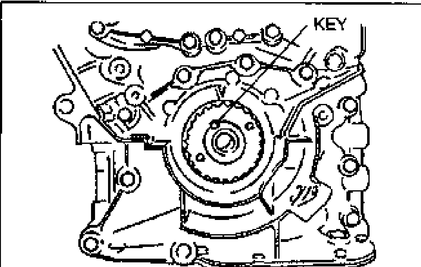 Line drawing showing the crankshaft key installation, with the crankshaft sprocket and oil pump body; the key is labeled 'KEY' to be installed with the tapered side toward the oil pump body.