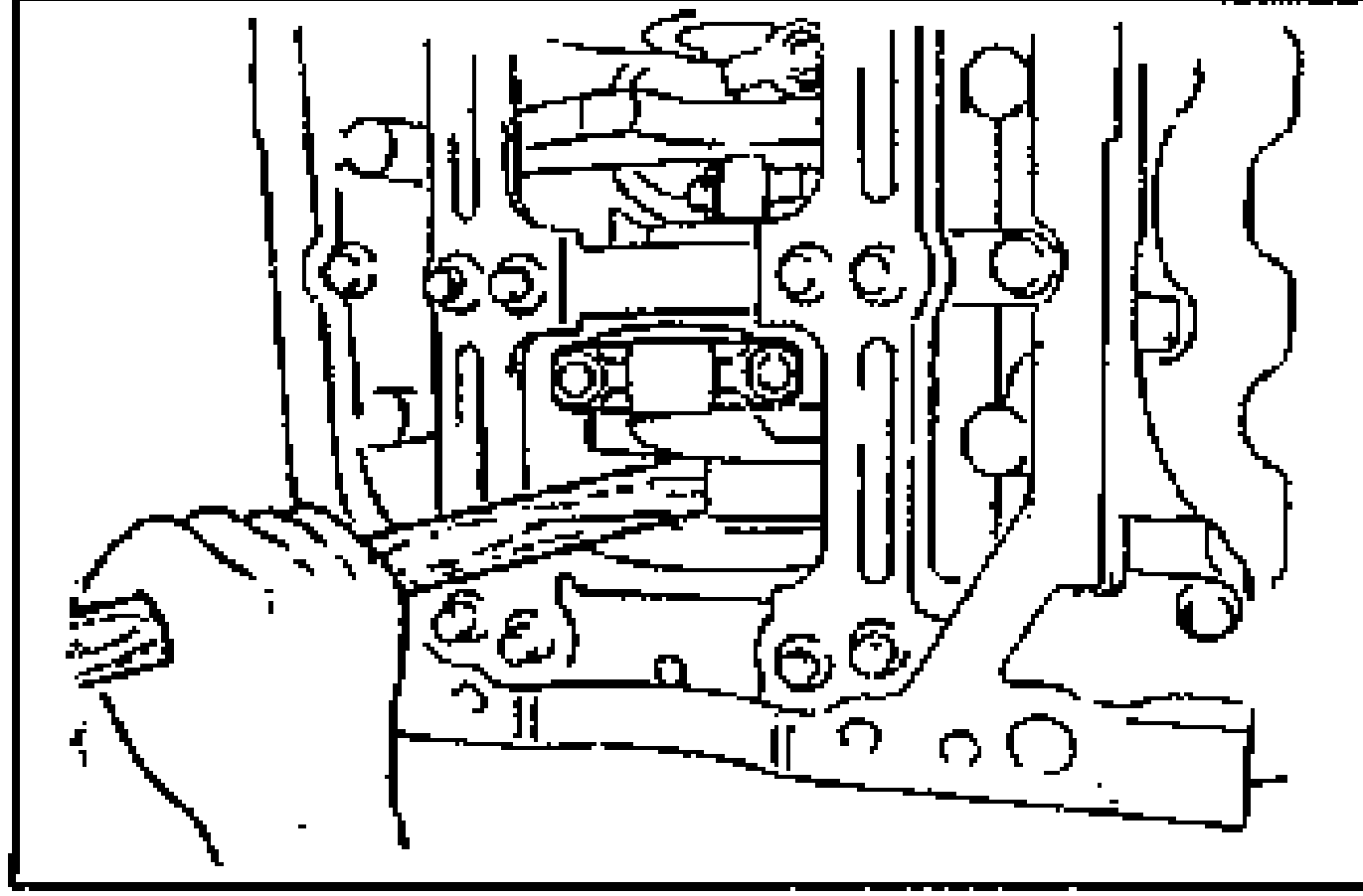 Line drawing of a hand using a hammer handle to push the piston and connecting rod assembly up through the top of the cylinder block.