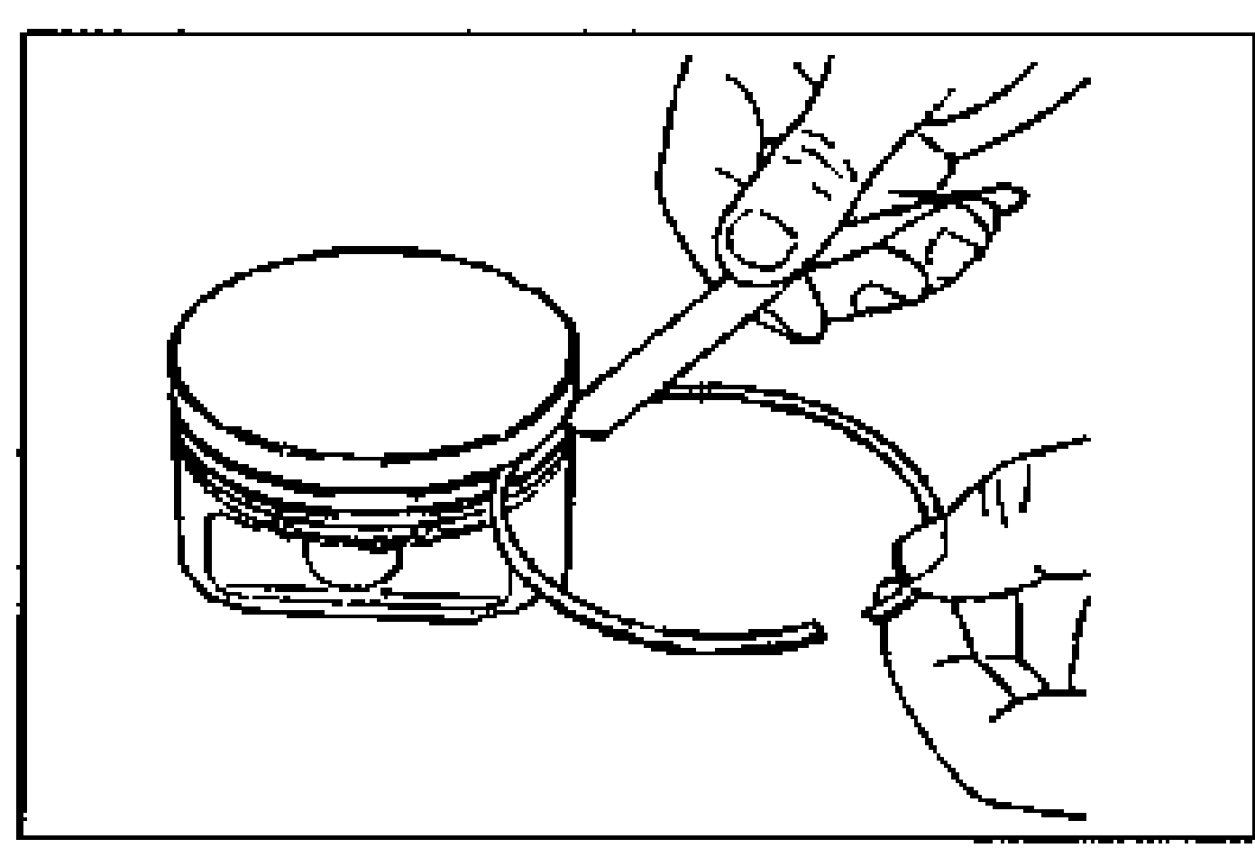 Measuring piston ring-to-ring land clearance: a hand holds a new piston ring against the piston ring groove with a feeler gauge.