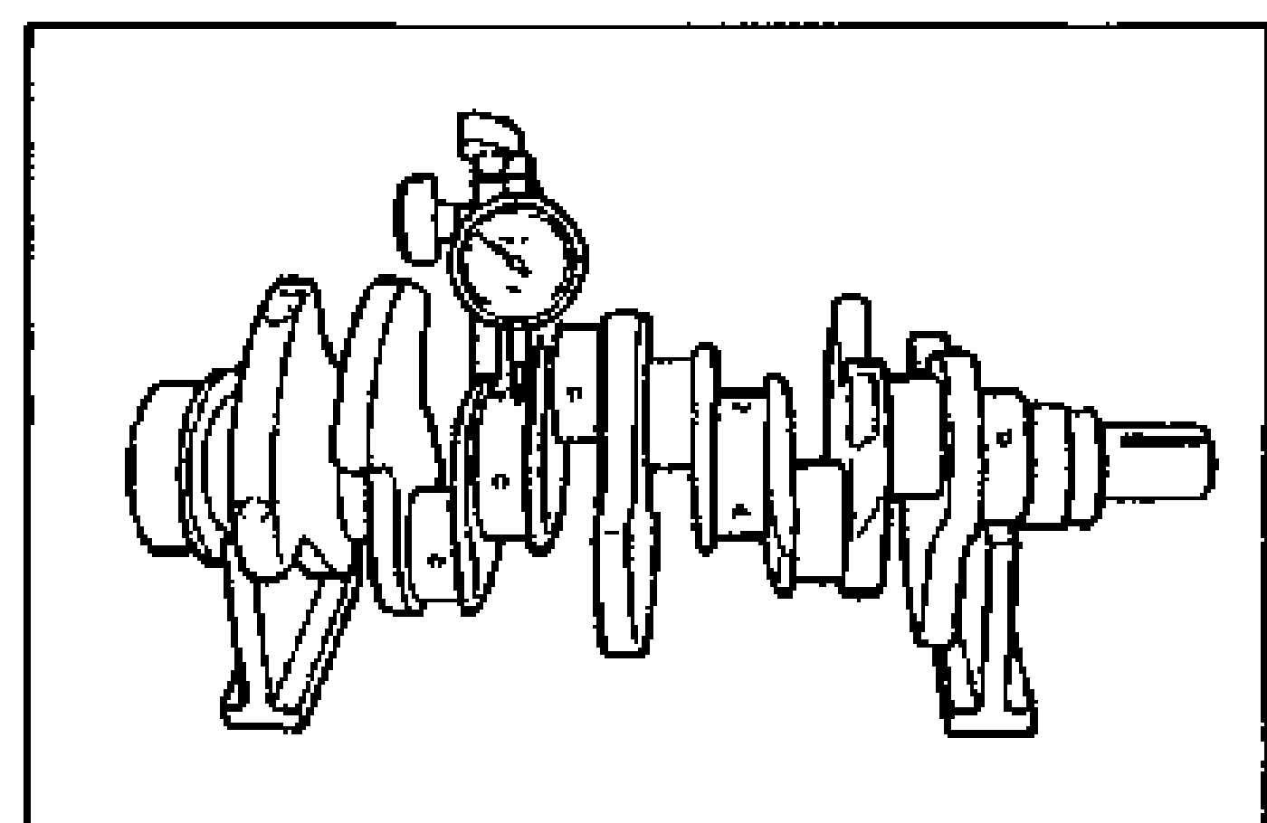 Crankshaft set on V-blocks with a dial indicator measuring runout at a center journal.