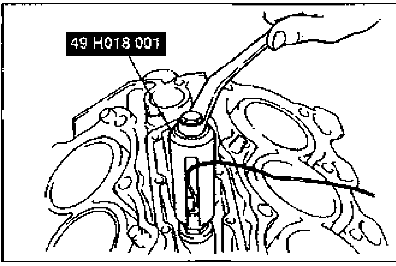 Line drawing of installing the knock sensor into the cylinder block valley using SST 49 H018 001 (a crow-foot type wrench).