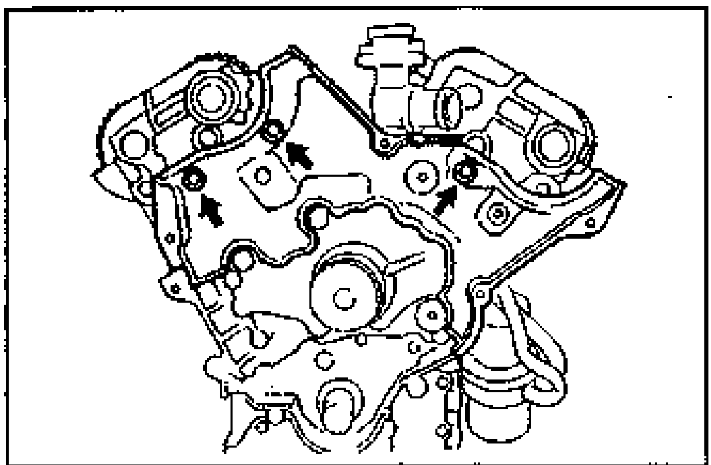 Seal plate installation at the engine front. Arrows point to the seal plate bolt locations.