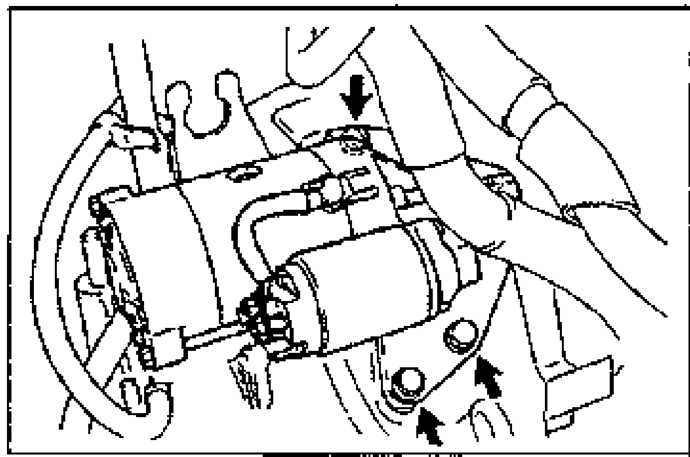 Starter motor being installed onto the transaxle housing. Arrows point to the starter mounting bolt locations.