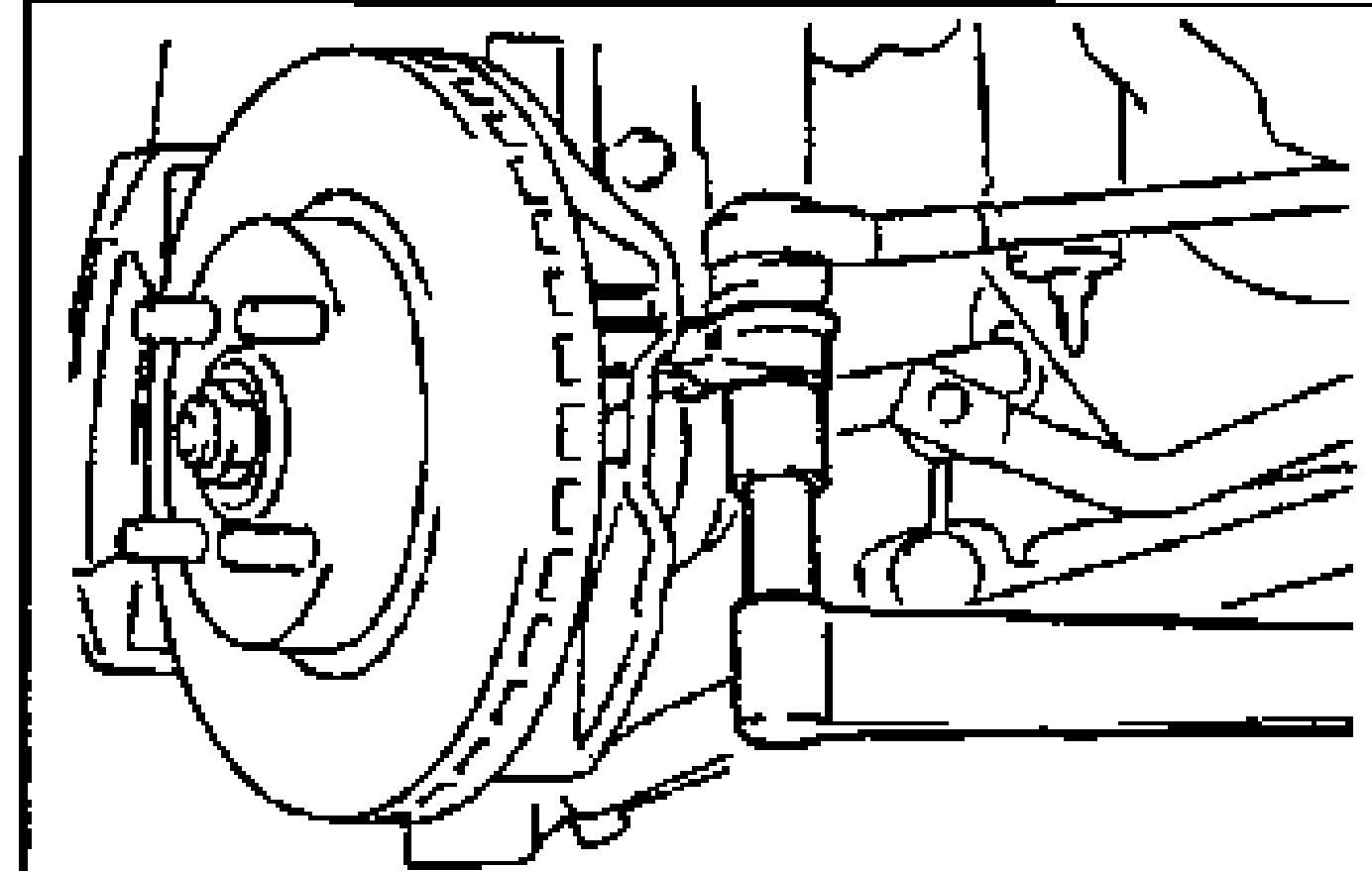 View of the front brake rotor/hub and knuckle area showing the tie-rod end ball joint connection to the knuckle.