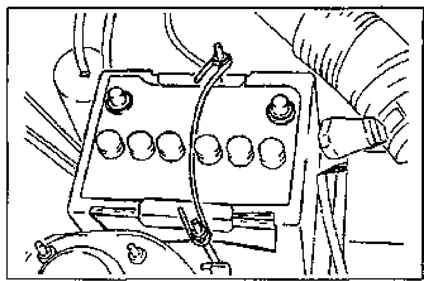 Engine-bay photo showing the battery installed in its tray with hold-down bracket and surrounding hoses/harness. Illustrates installing the battery.