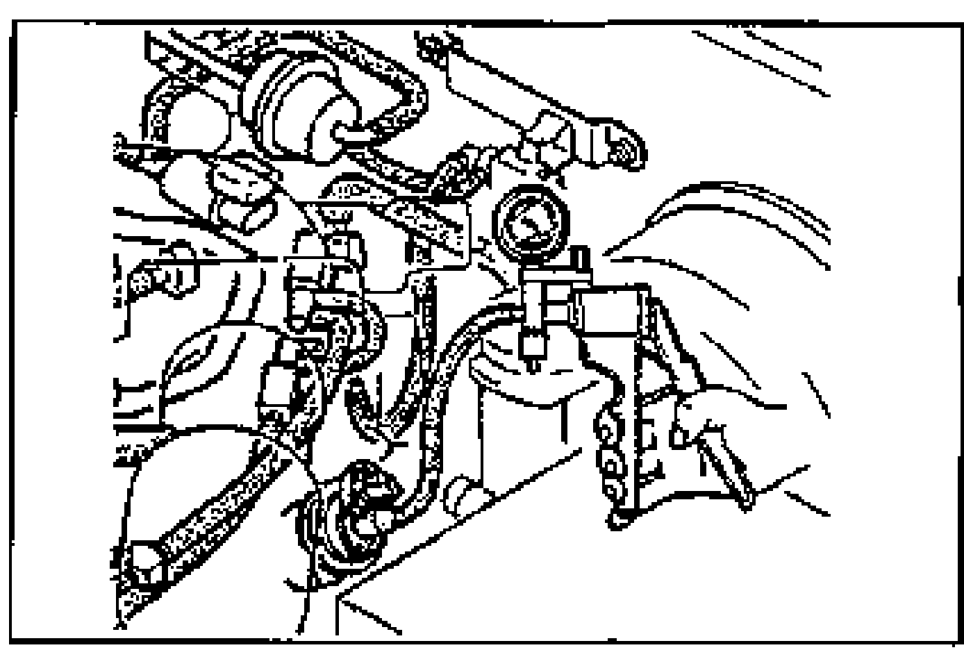 Engine-bay view of the EGR valve with a vacuum pump connected, illustrating the EGR valve inspection where vacuum is applied.