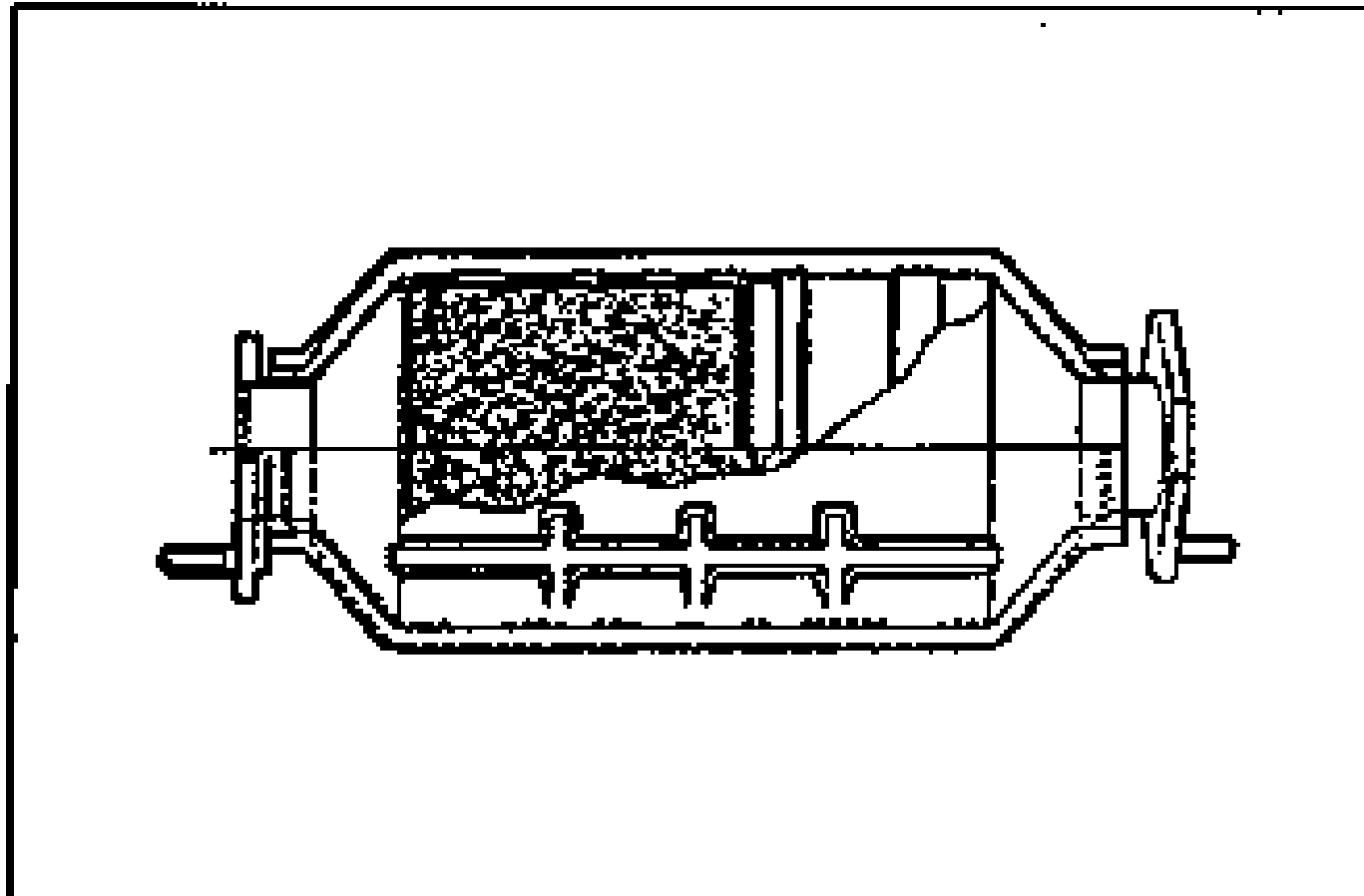 Cutaway drawing of the three way catalytic converter showing the internal honeycomb catalyst element inside the converter housing with flanges at each end.