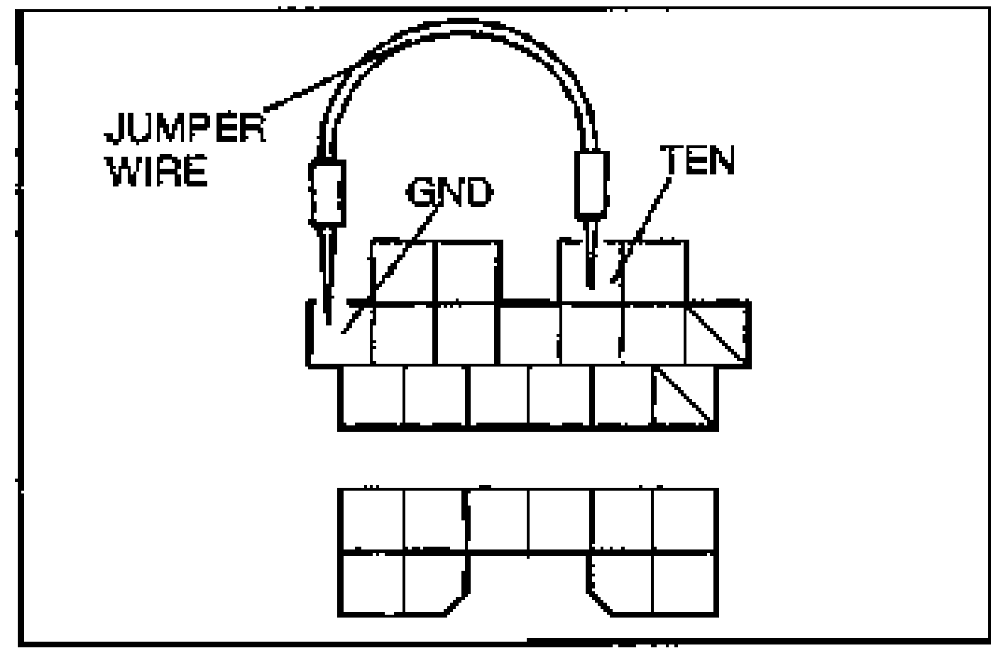 Diagram of the data link connector with a jumper wire bridging the GND and TEN terminals. Callouts: JUMPER WIRE, GND, TEN. Shows two rows of square connector terminals.