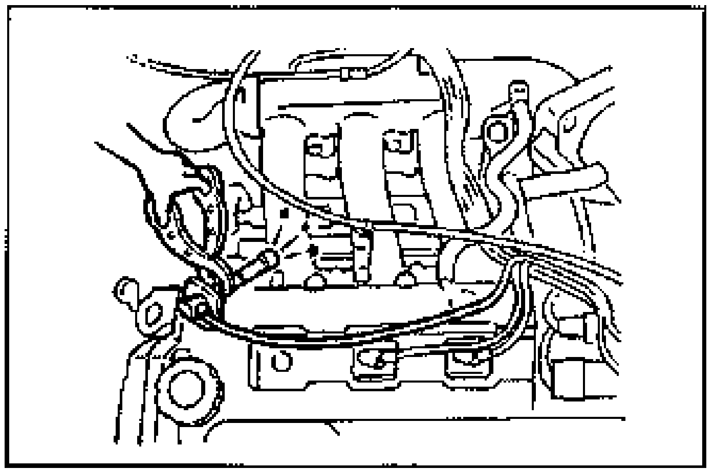 Engine-bay view of the distributor and high-tension leads used for the distributor spark test.