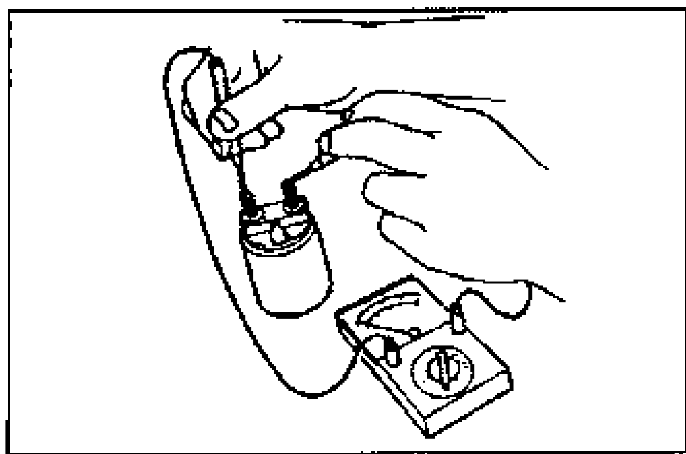 Hand using an ohmmeter to check continuity (grounding) between terminals M and B on the magnetic switch.