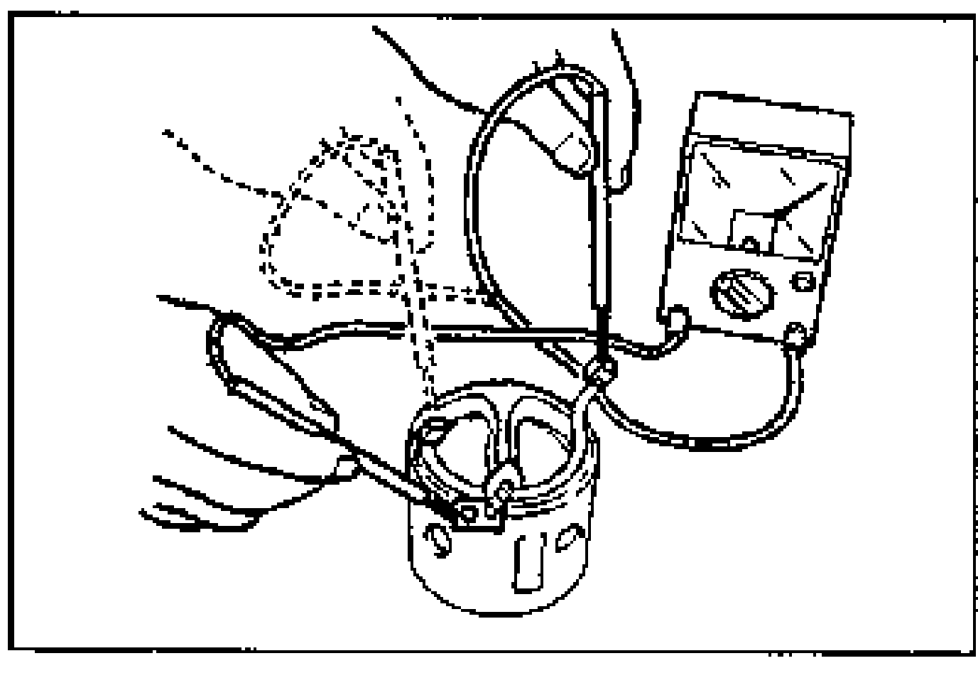 Hand using an ohmmeter to check continuity between the terminal M wire and the brushes on the yoke.