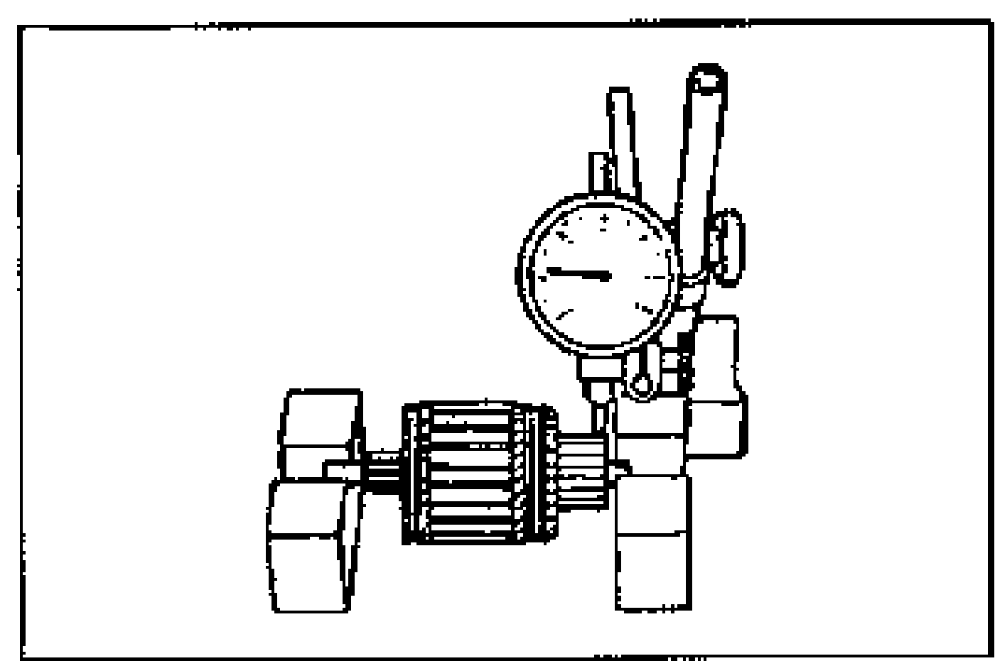 Armature placed on V-blocks with a dial indicator measuring commutator runout.