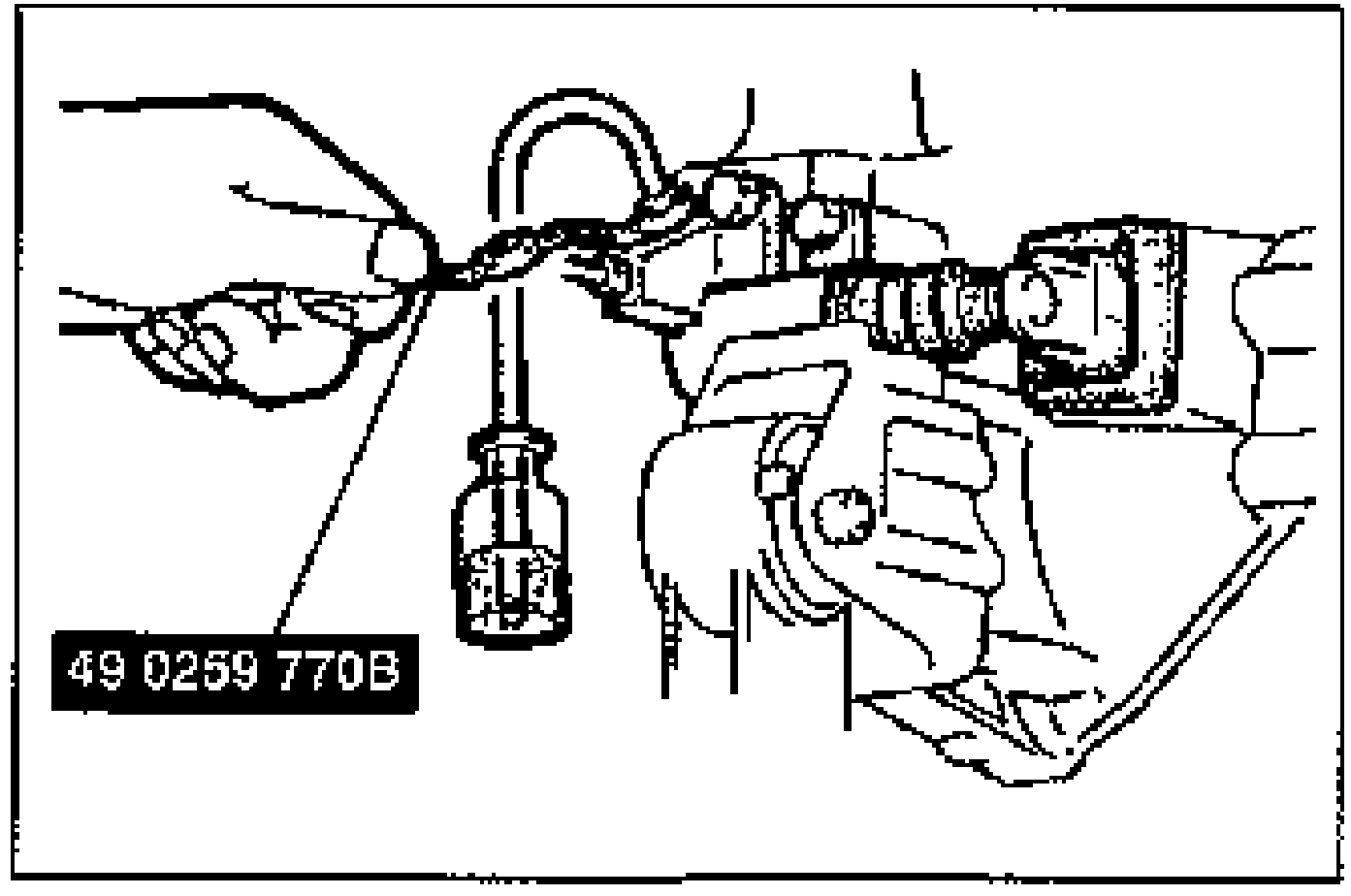 A hand using the SST flare-nut wrench (49 0259 770B) on the bleeder screw of the clutch release cylinder, with a vinyl hose attached to the bleeder plug for air bleeding.