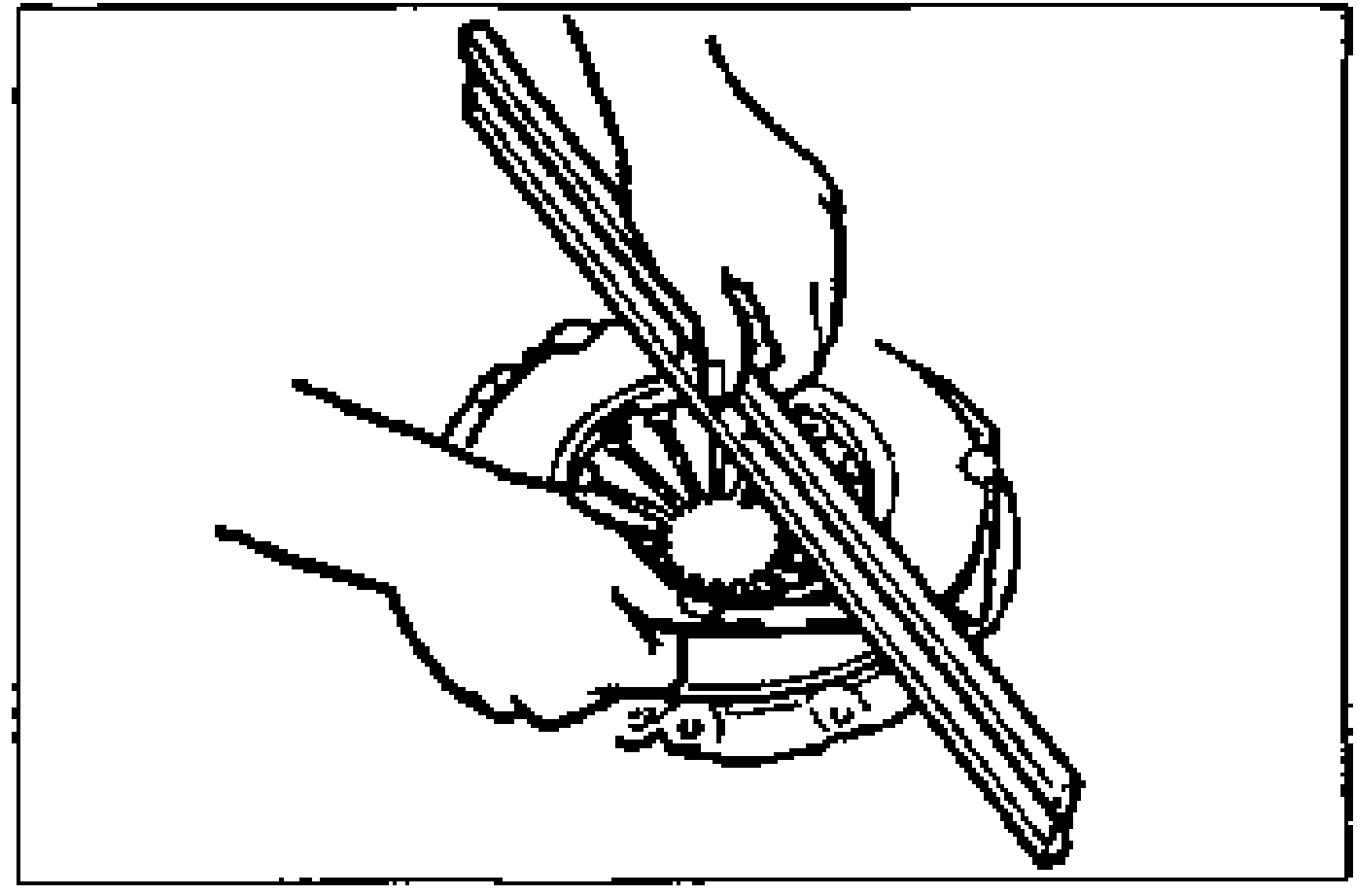 Inspection of the flatness of the pressure plate contact surface using a straightedge and a feeler gauge.
