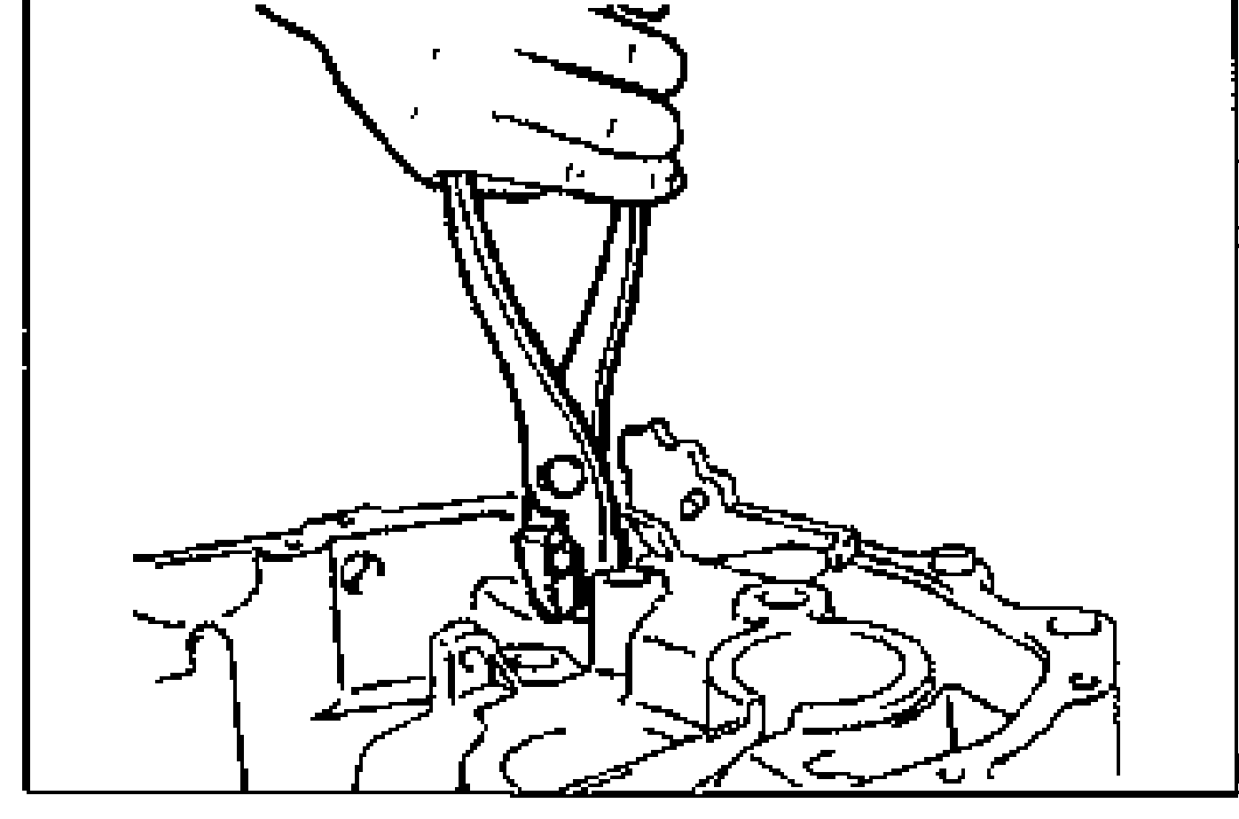 Illustration of protecting the reverse lever shaft with a rag and using pliers to remove the shaft from the transaxle case.