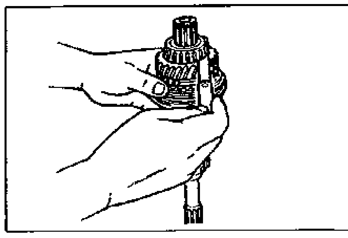 Hand holding the primary shaft assembly while measuring the clearance between the 4th gear and the bearing.