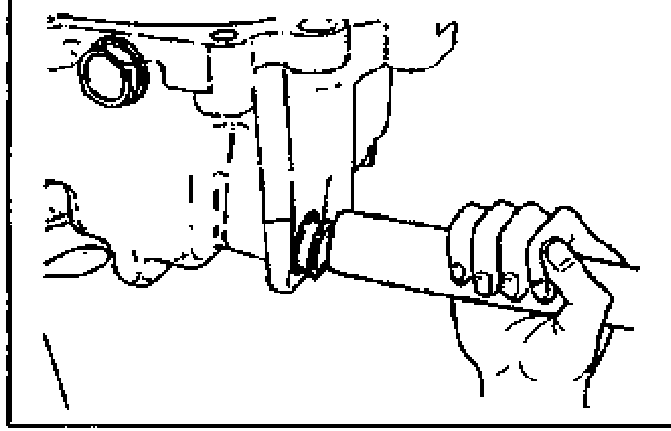 Installing the new oil seal for the change rod assembly using a suitable pipe; hand holds the pipe against the seal bore.