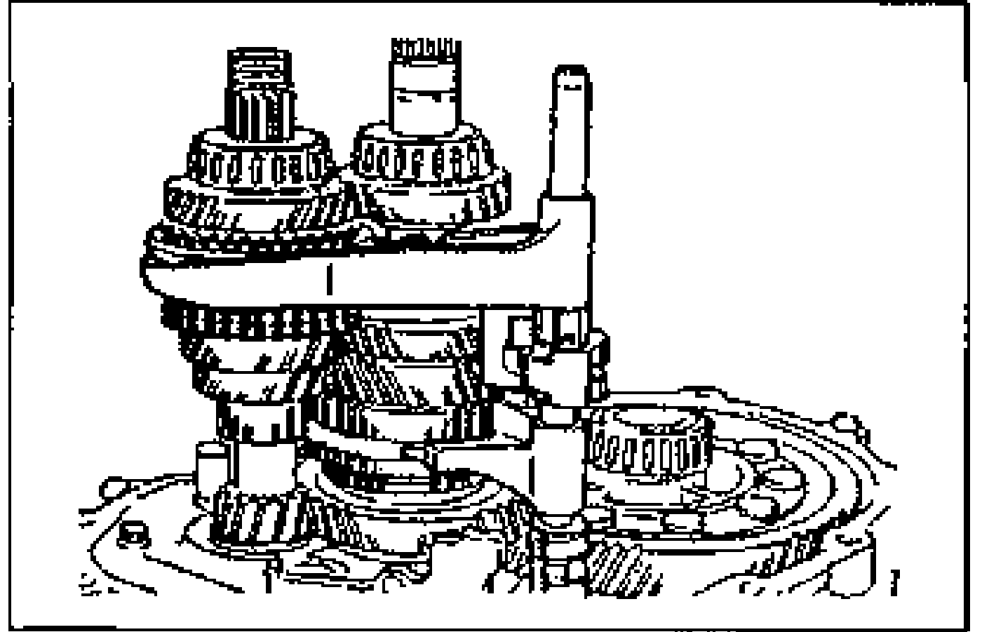 Photo of the shift fork and shift rod assembly positioned in 2nd gear over the installed gear cluster, showing the shift rod standing vertically and the forks engaged on the gear sleeves.