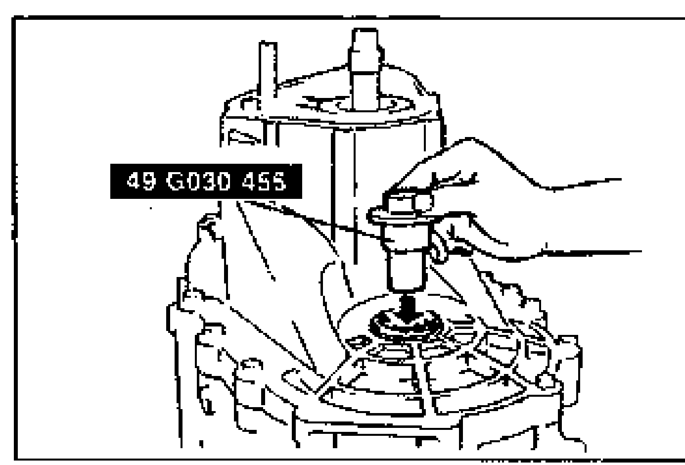 Photo of the transaxle case being assembled with SST 49 G030 455 inserted through the drive shaft and joint shaft hole; a hand guides the tool down into the case. SST label 49 G030 455 printed at left.