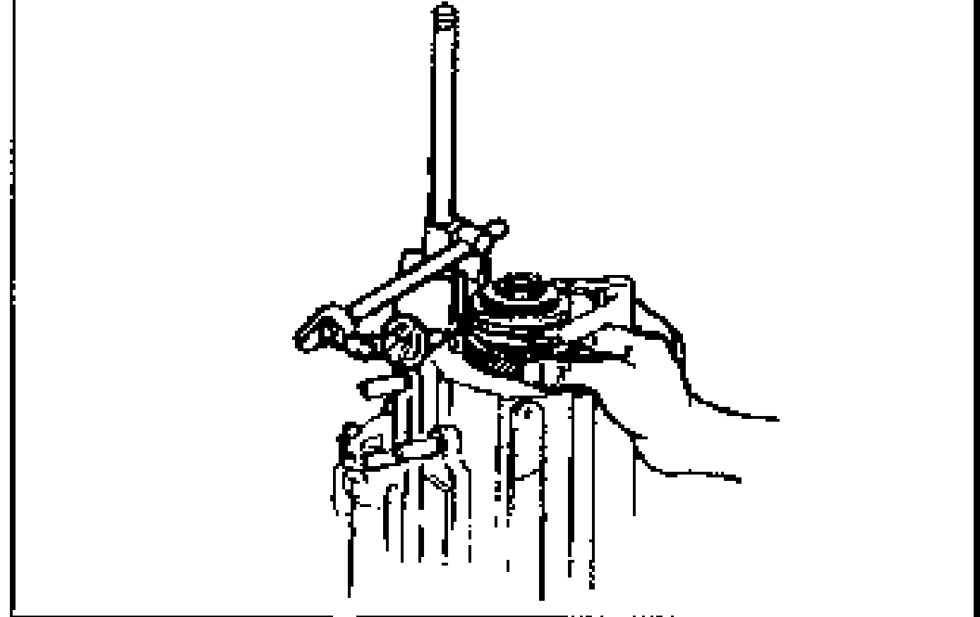 Photo of the primary shaft being locked with SST 49 G030 440 while a wrench tightens the locknut. SST label 49 G030 440 printed at lower-left.