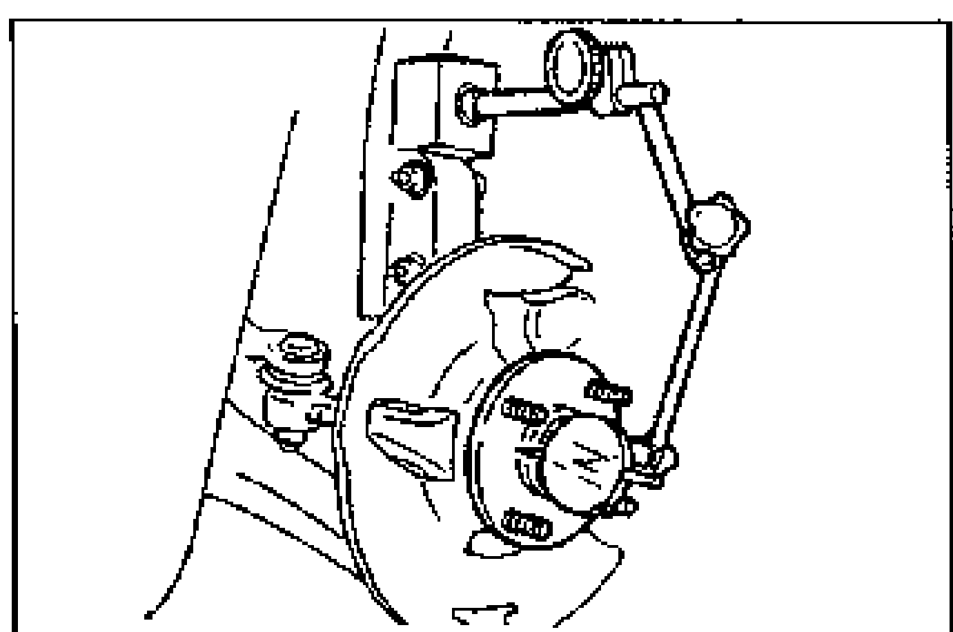 Front wheel hub / steering knuckle assembly with a dial indicator positioned against the wheel hub to measure wheel bearing play. The hub, brake disc backing, tie-rod and lower arm are visible. An arrow indicates the axial push/pull direction.