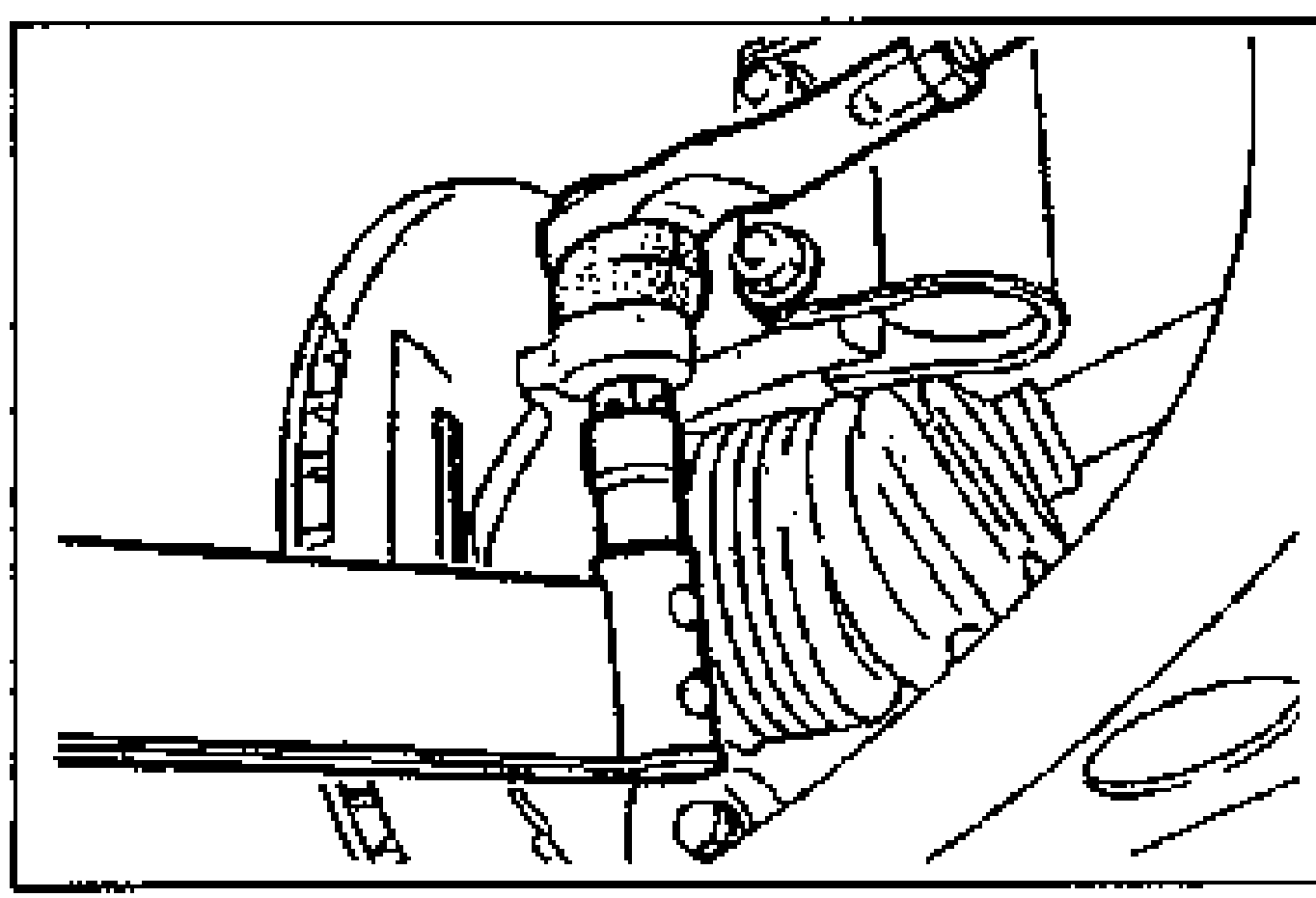 Line drawing of the tie-rod end and dust boot positioned over the knuckle hole, with the nut installed on the tie-rod end.