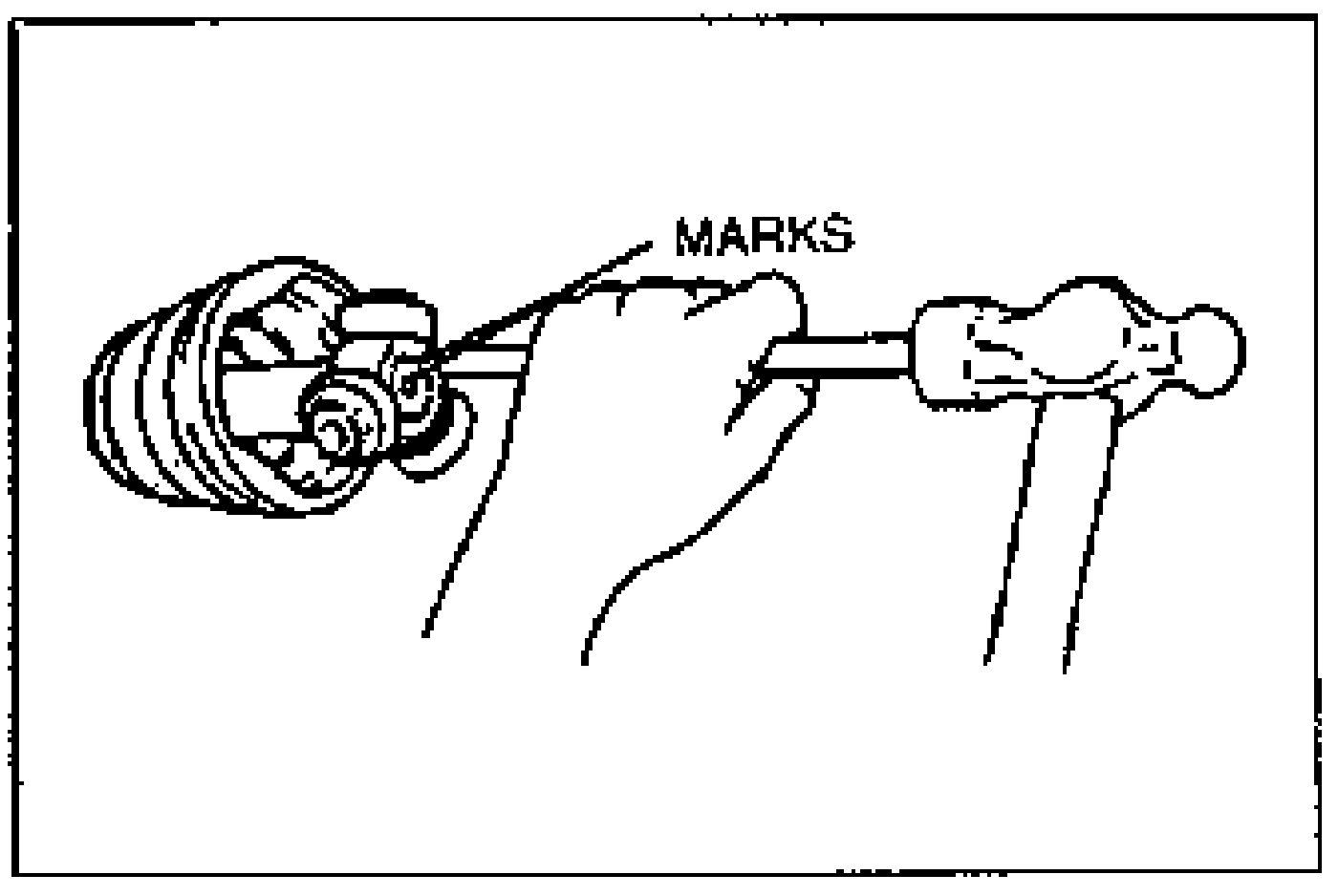 Line drawing of aligning the marks and installing the tripod joint with a bar and a hammer. The alignment marks are labeled MARKS.