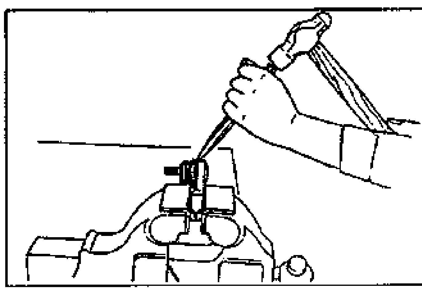 Line drawing of a hand holding a chisel against the tie-rod end boot, which is secured in a vise, with the chisel held at the angle shown to remove the boot by tapping with a hammer.