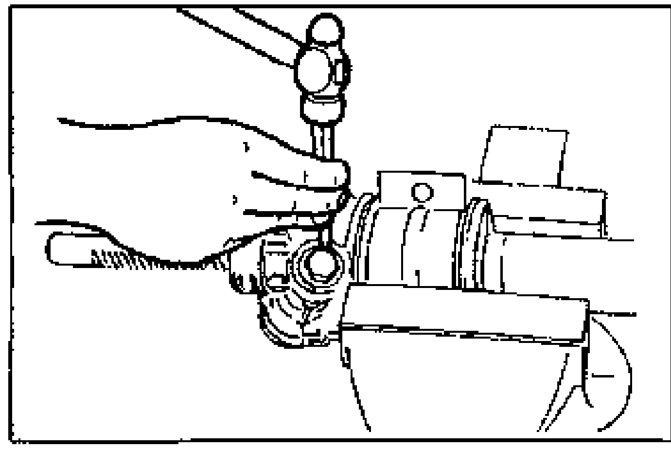 Hand staking between the rack housing and housing cover with a center punch.