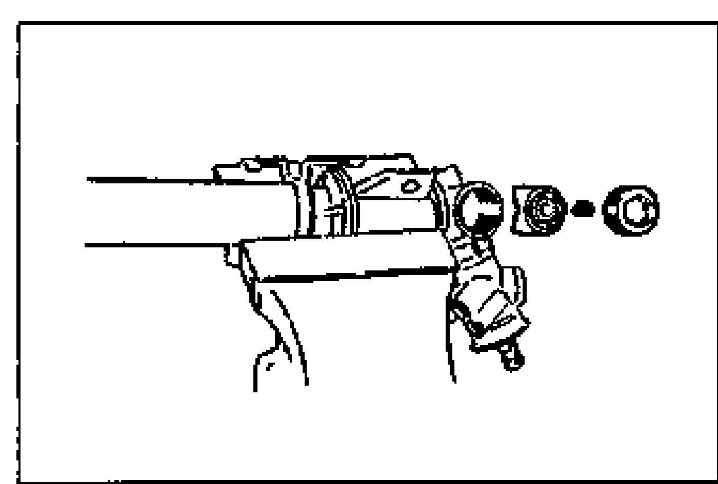 Gear housing secured in a vise with the support yoke position facing upward; support yoke and spring being installed.