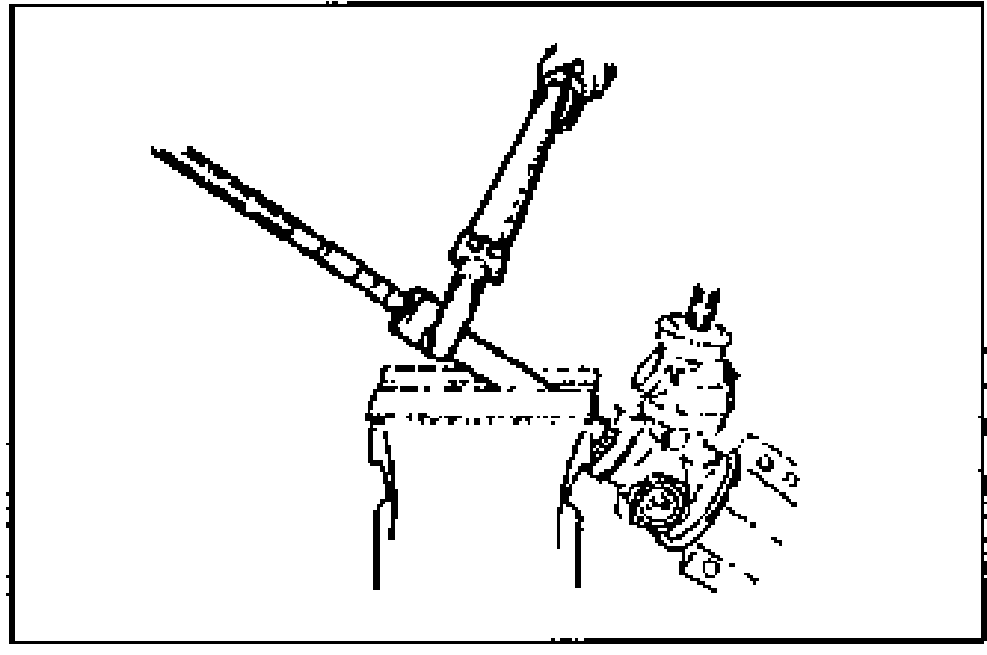 Rack secured in a vise; tie rod being removed.