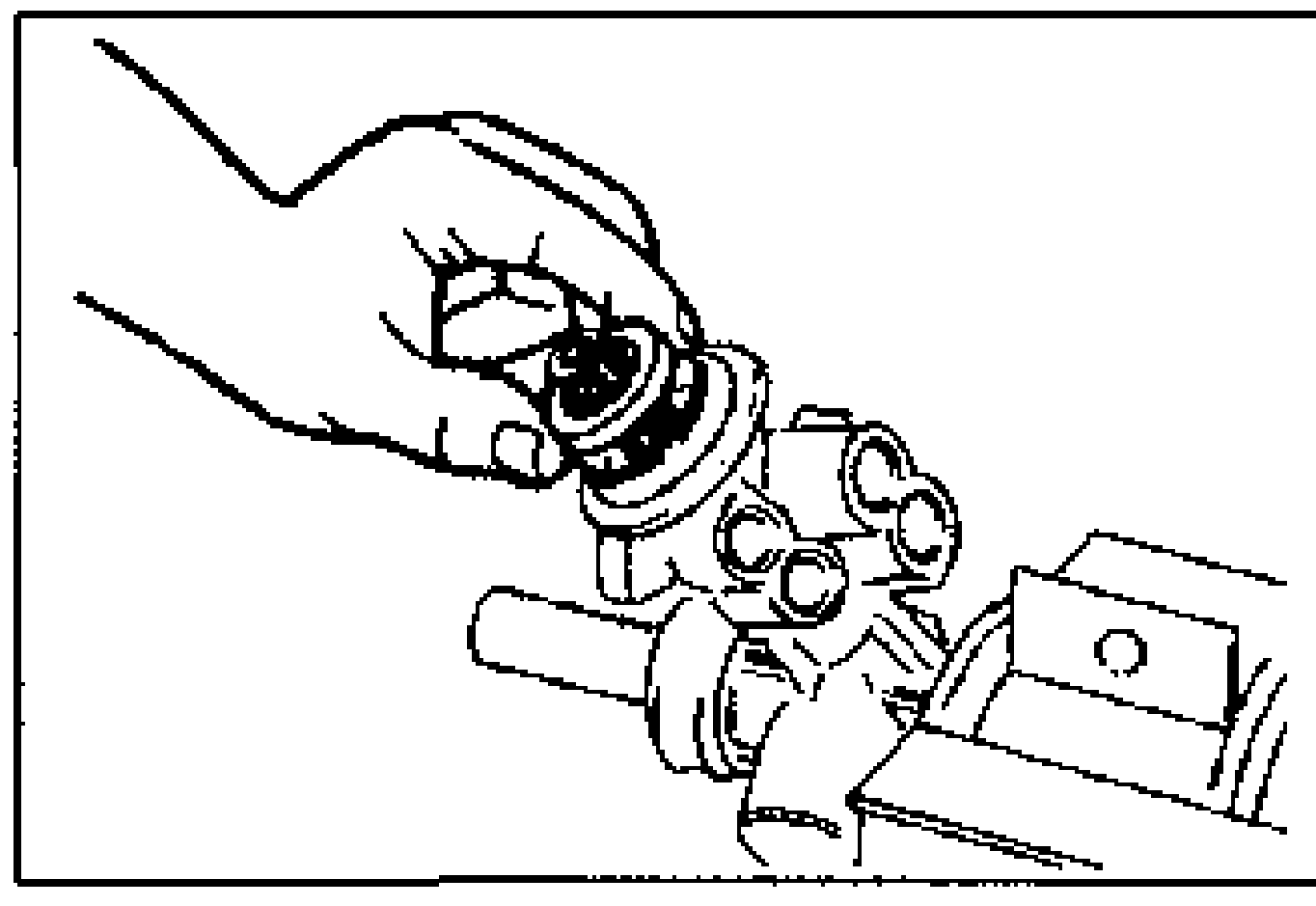Line drawing of installing the upper bearing onto the pinion shaft/housing held in a vise after applying ATF.