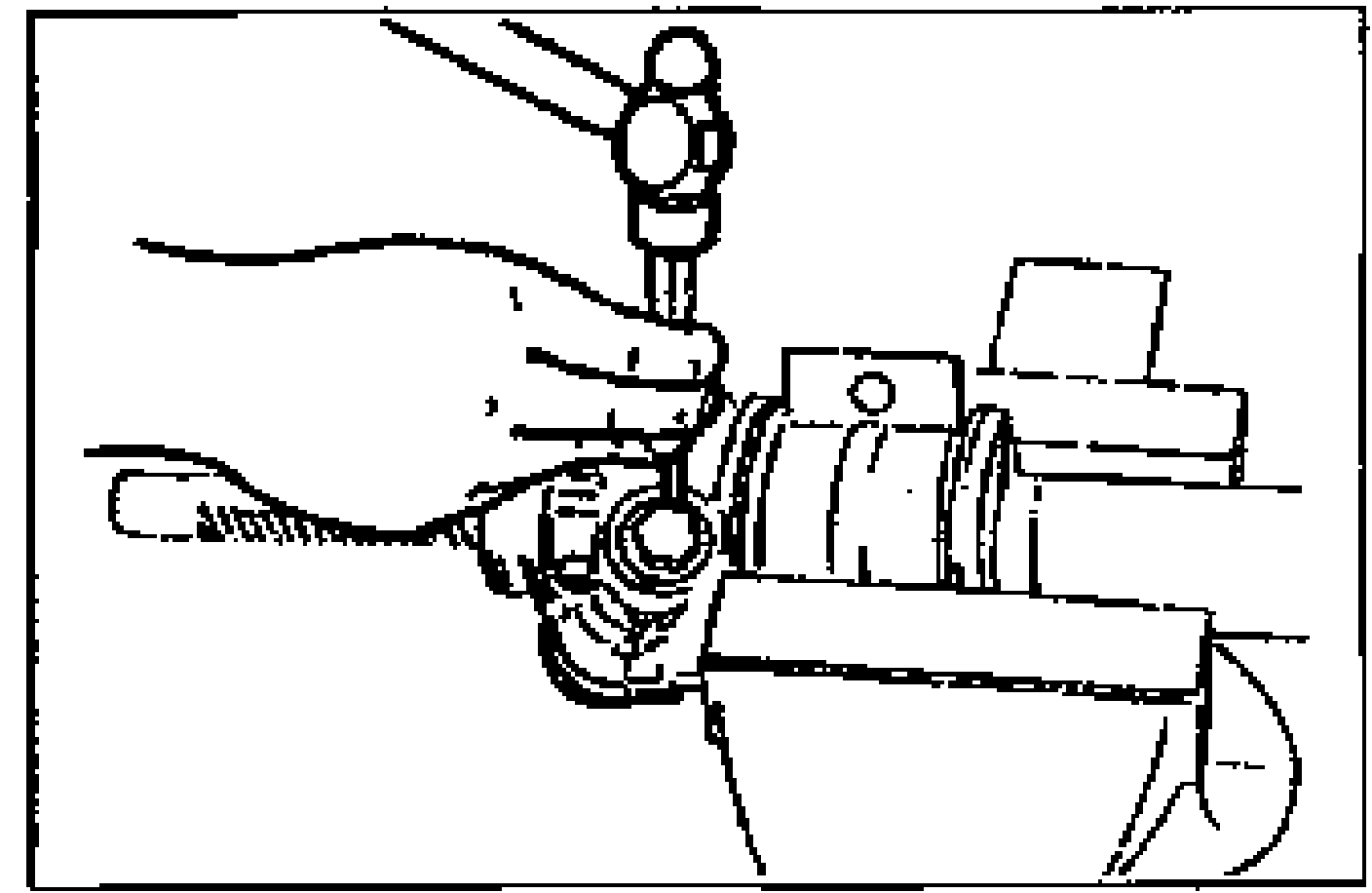 Line drawing of staking between the rack housing and housing cover at two points with a center punch.
