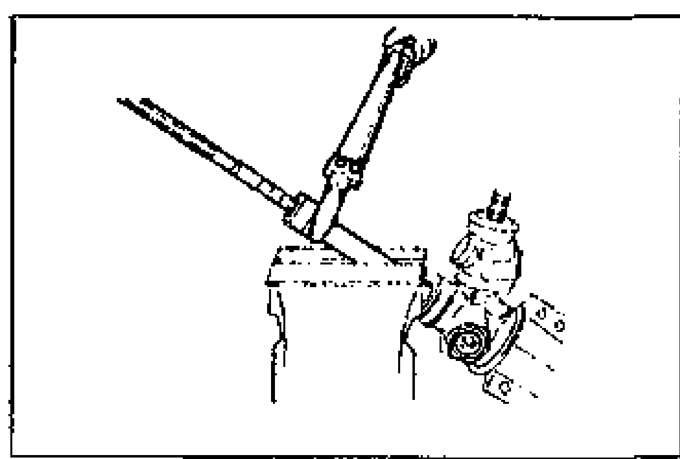 Line drawing of installing the tie rod onto the rack with the rack secured in a vise and a wrench.