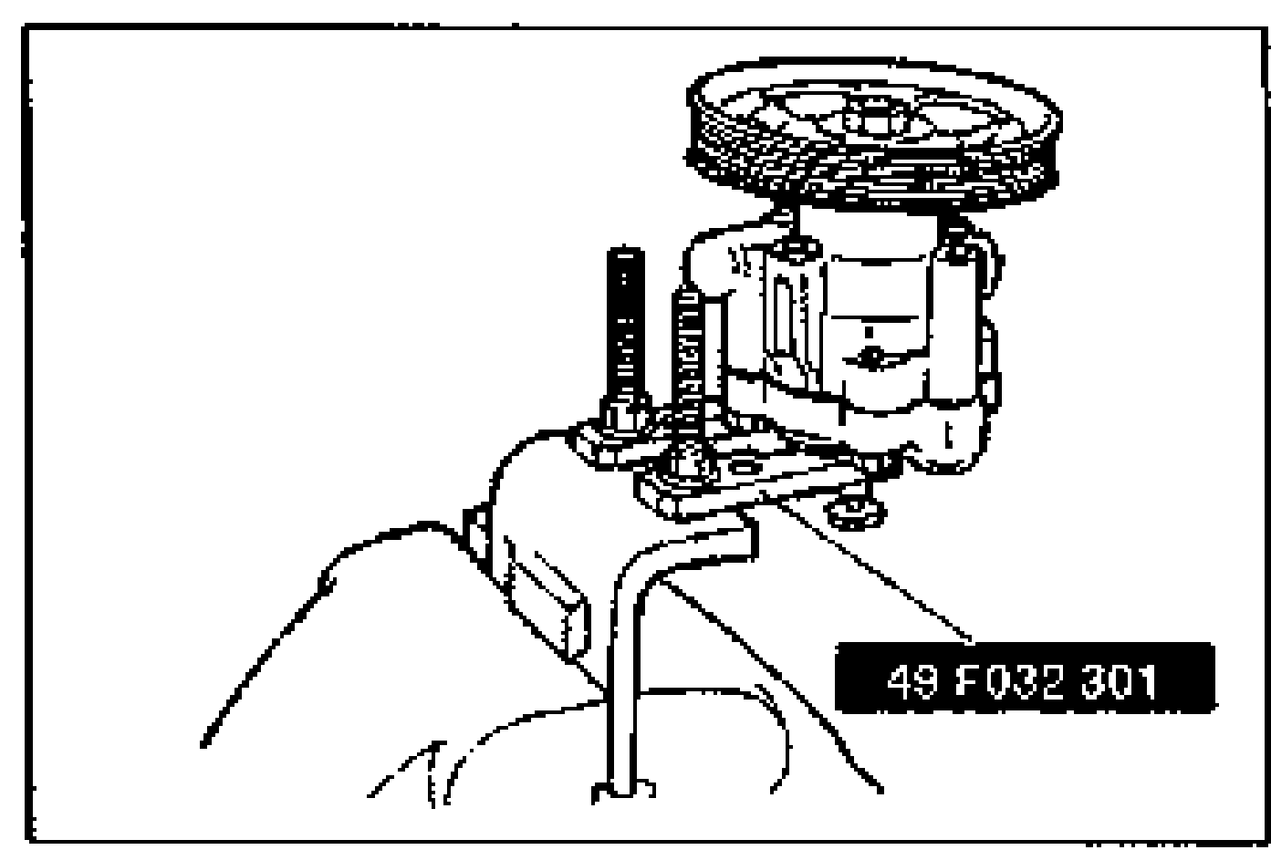 Oil pump assembly secured in a vise using SST 49 F032 301 (holding plate) and bolts, with the pulley facing up.