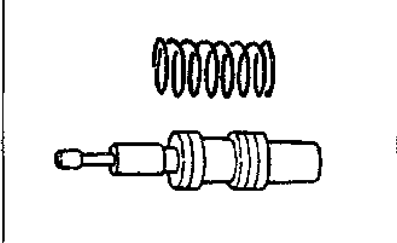 Control valve and spring shown separated: coil spring (top) above the control valve spool (bottom).