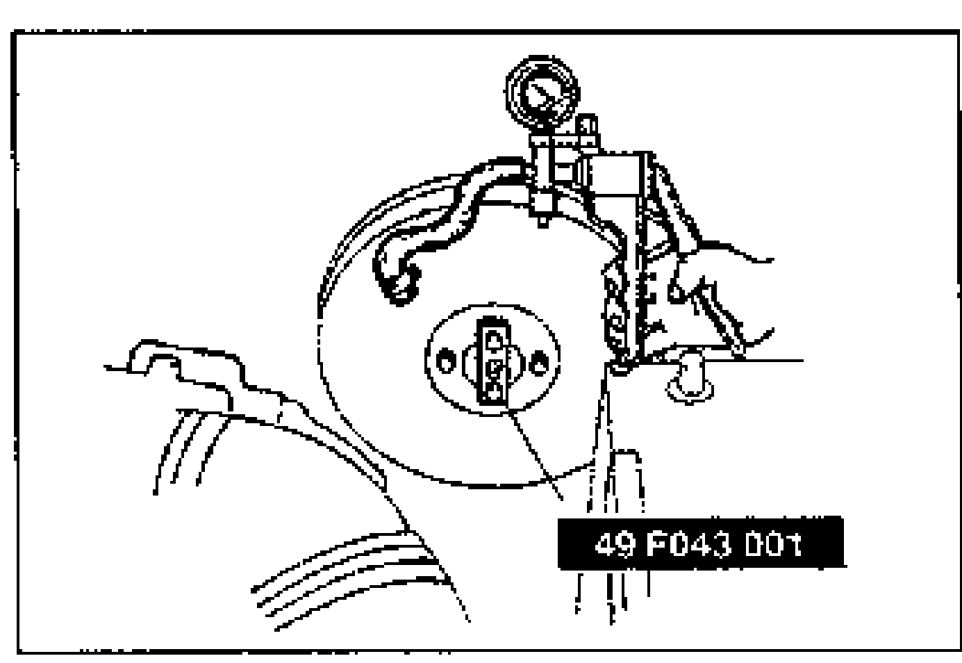 Power brake unit with a vacuum pump and adjustment gauge attached to the front face. An arrow points to the push rod region at the center of the unit.