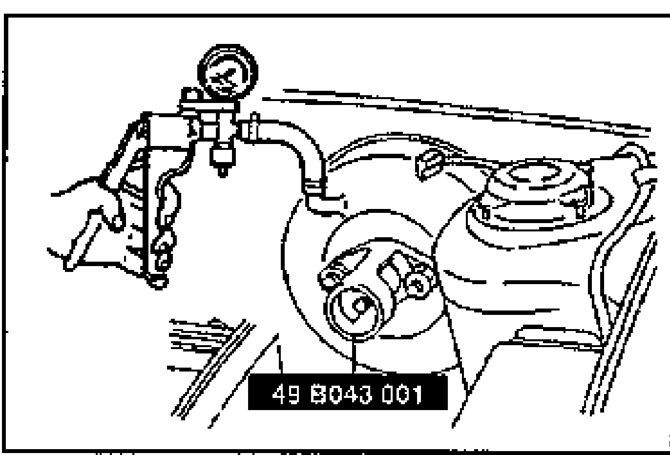Power brake unit with the SST push rod gauge (49 B043 001) attached and a vacuum gauge/pump connected, viewed in the engine compartment.