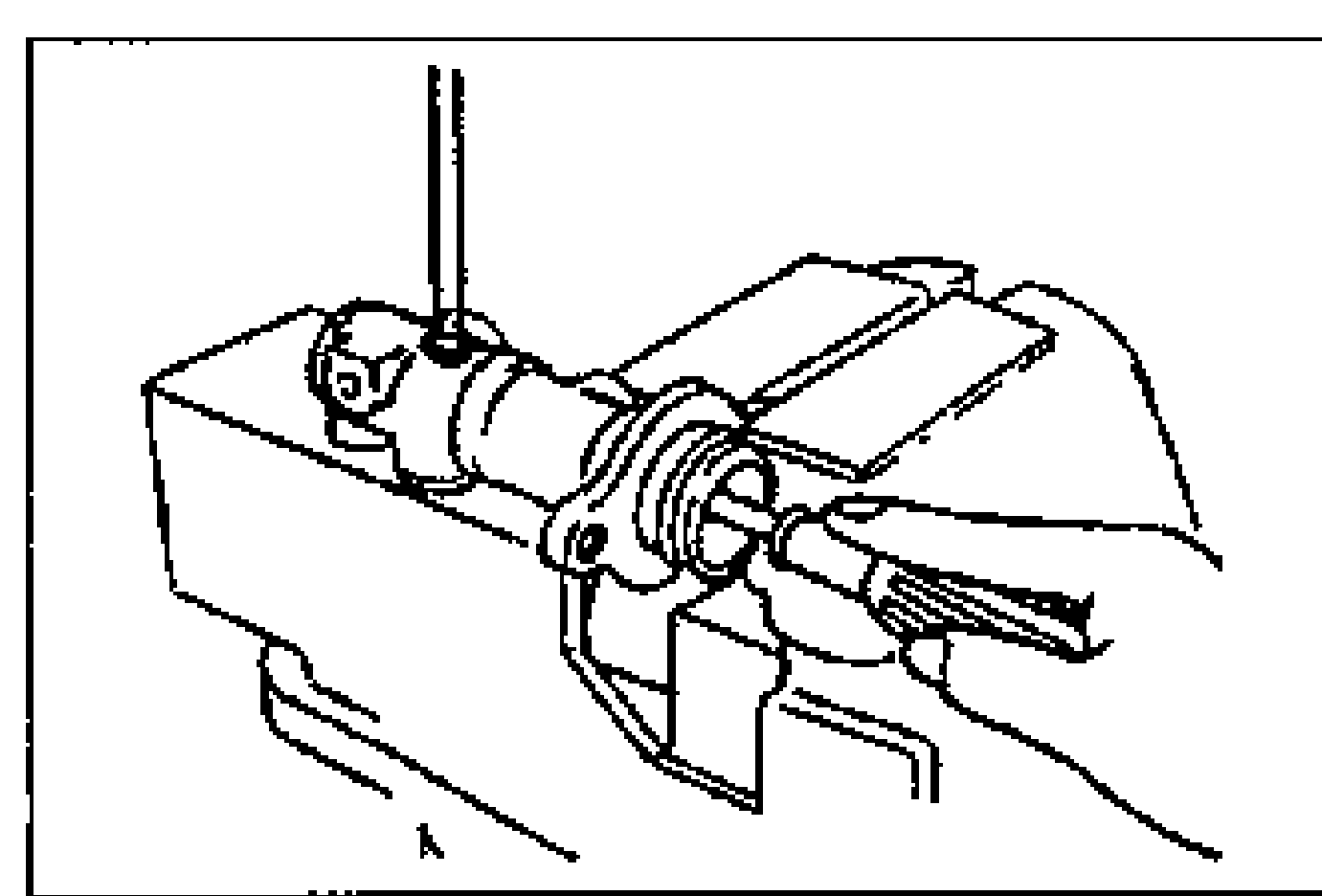 Master cylinder body clamped in a vise (by its flange) with the secondary piston assembly installed; a screwdriver is inserted into the stop screw bore from the top to install the stop screw.