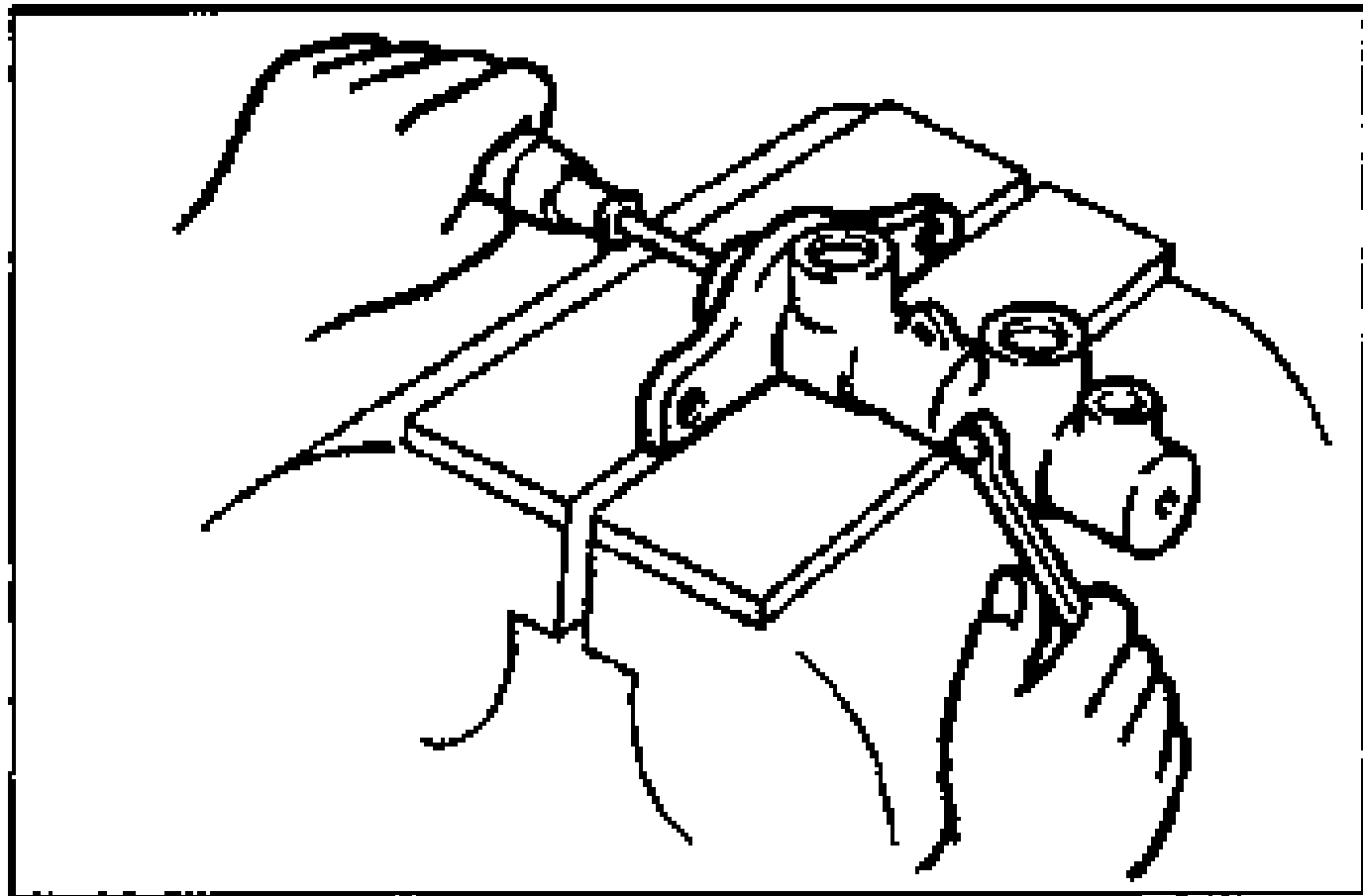 Master cylinder body clamped in a vise with the ABS-type secondary piston assembly installed; a hand uses a tool to install the stop pin from the side while pushing the piston.