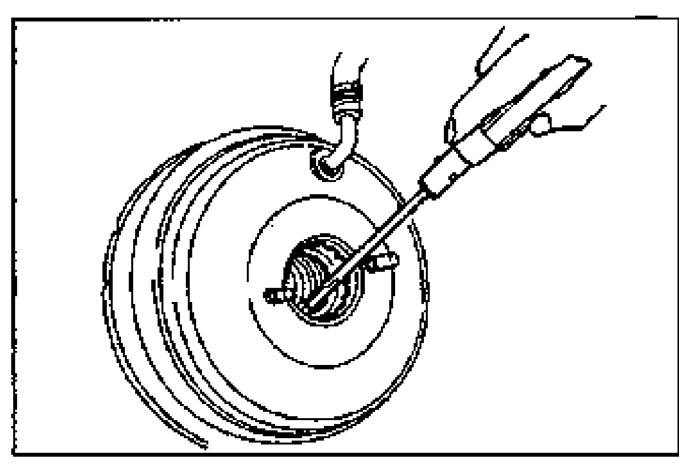 Front face of the power brake unit; a screwdriver/pry tool is inserted at the center to pry off the retainer of the seal and plate assembly.