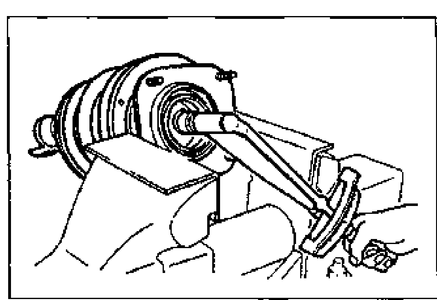 Illustration of the front strut/shock absorber assembly clamped horizontally in a vise with a wrench tightening the mounting block nut.