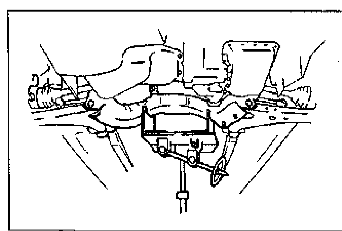 Underside view of the front crossmember supported by a jack, showing the stabilizer bracket and bolts/nuts being removed to free the stabilizer bar.