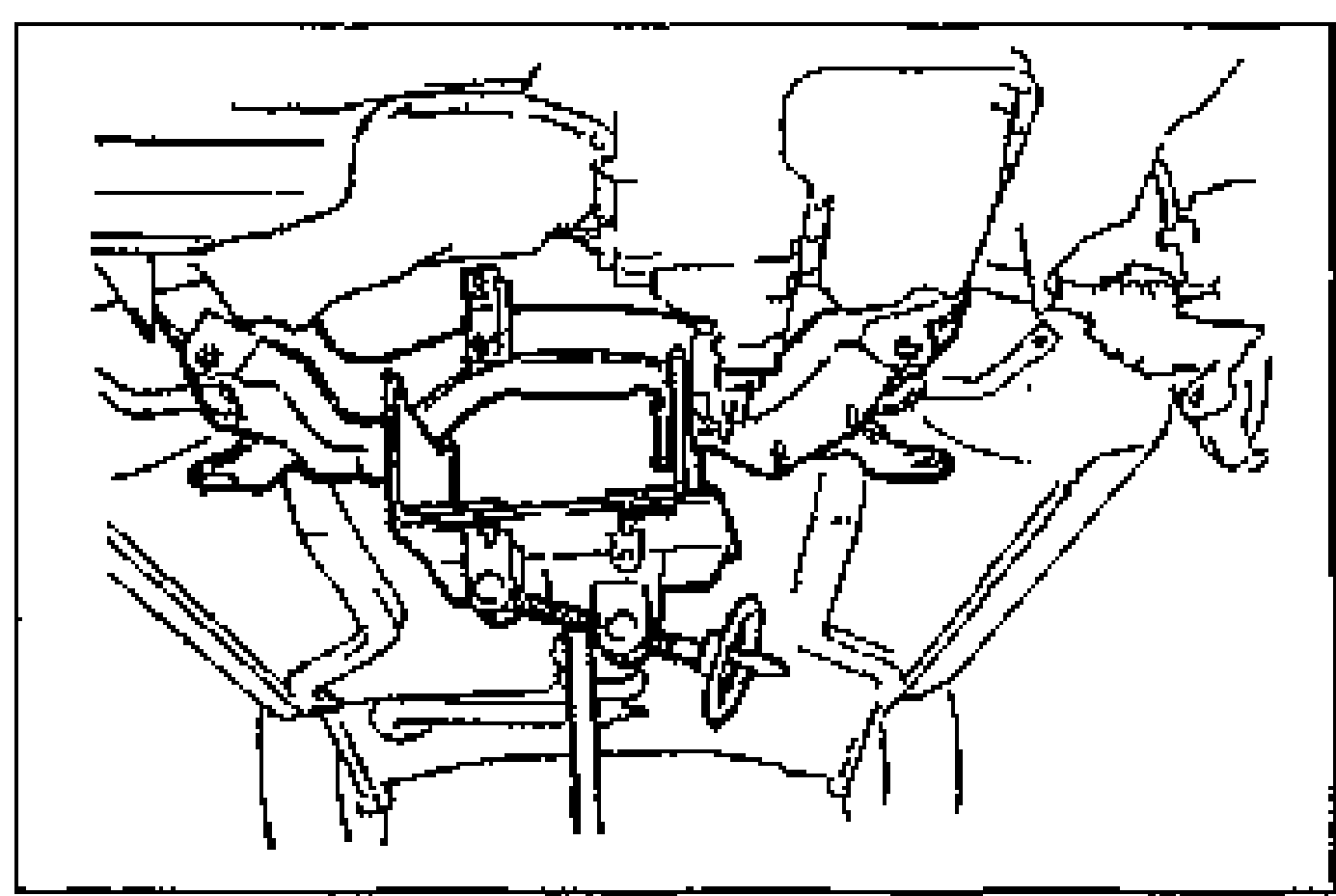 Underside view of the front crossmember supported by a jack, with the bolts and nuts removed prior to lowering and removing the front crossmember.