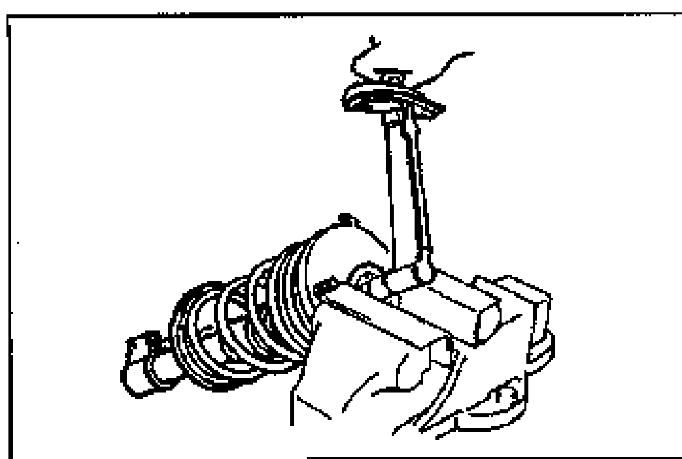 Shock absorber/coil spring assembly secured in a bench vise via the mounting block, with a wrench tightening the nut to the specified torque.