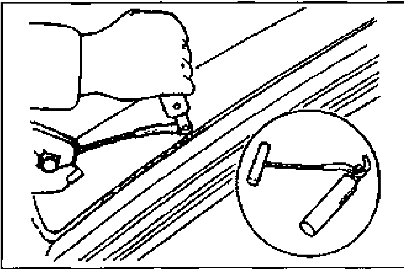 Hand using a blade tool inserted into the windshield sealant around the glass edge (glass-not-reused method). A magnified inset circle shows the T-handle cutting tool.