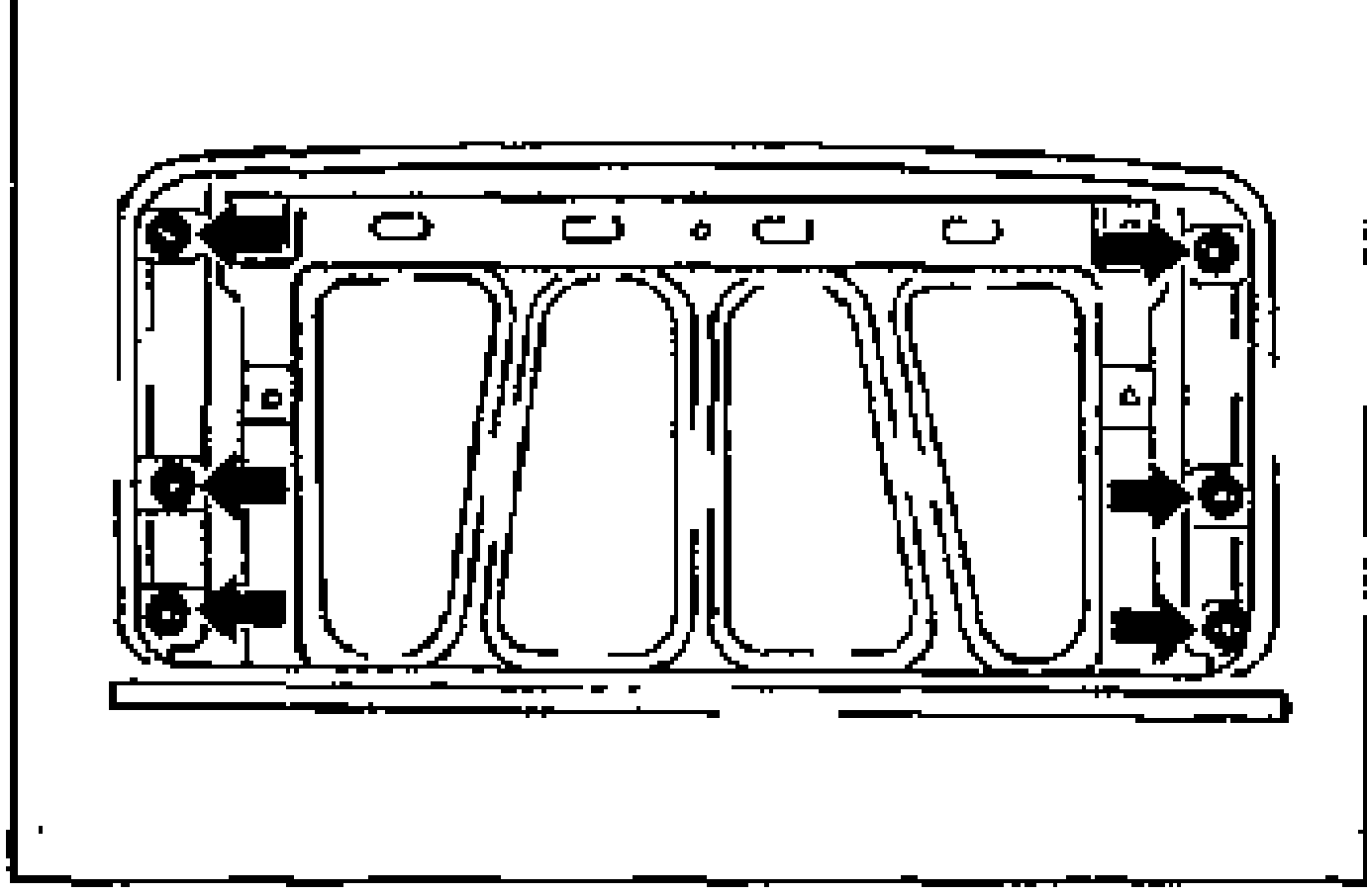 Underside view of the slide panel showing the slide panel fixing nuts (arrows) at the corners to be removed.