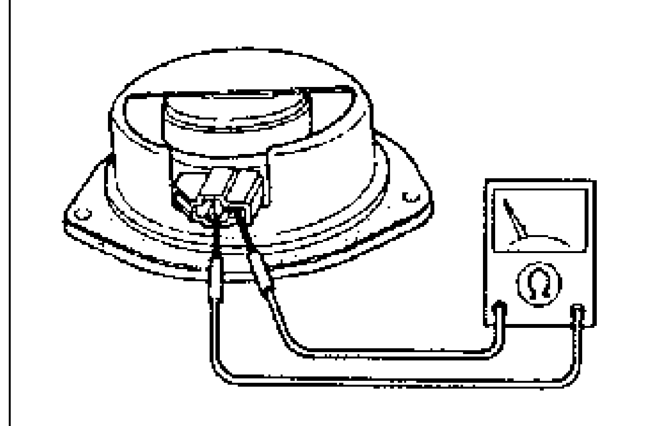Photo of the door speaker with an ohmmeter measuring resistance between the speaker terminals.